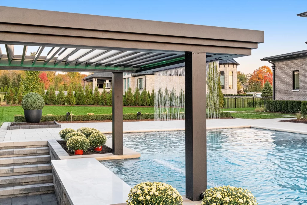 Contemporary composite decking around a pool with lounge chairs, showing low maintenance and modern style